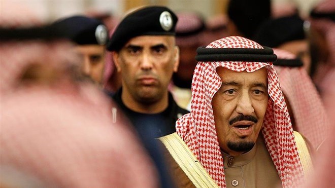 In this file photo, Saudi Arabia's King Salman is guarded by his bodyguard Maj. Gen. Abdulaziz al-Fagham, back ground [Yoan Valat, AP Photo]